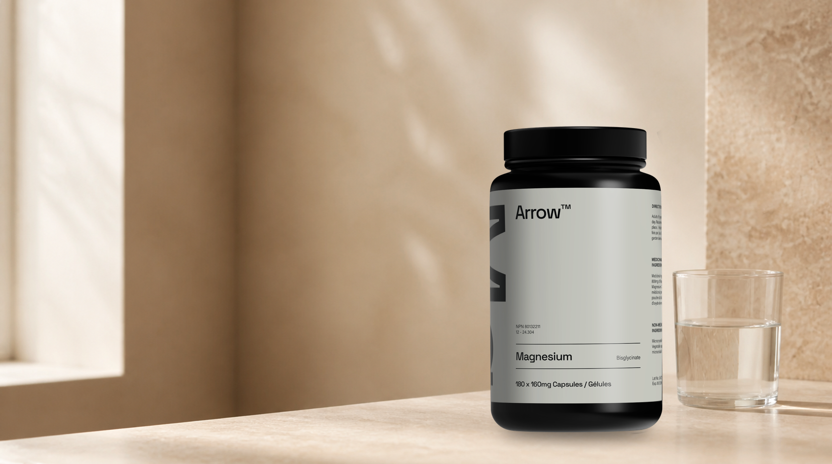 Arrow Magnesium Bisglycinate beside a glass of water