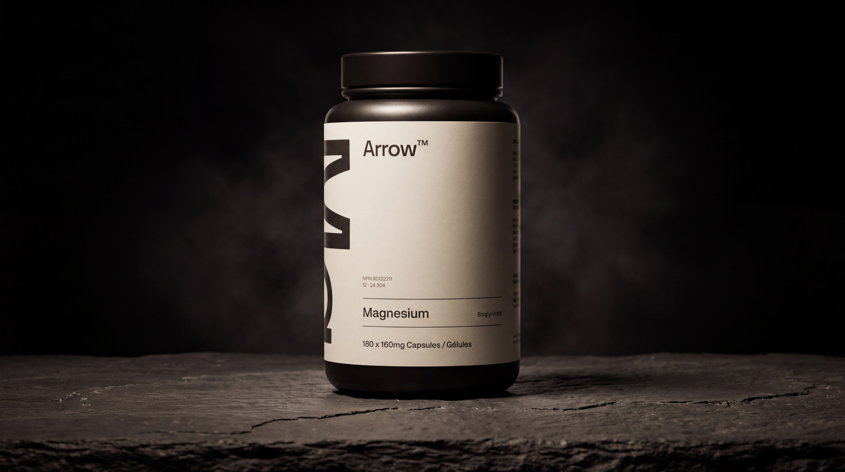 Arrow Magnesium Bisglycinate beside a glass of water